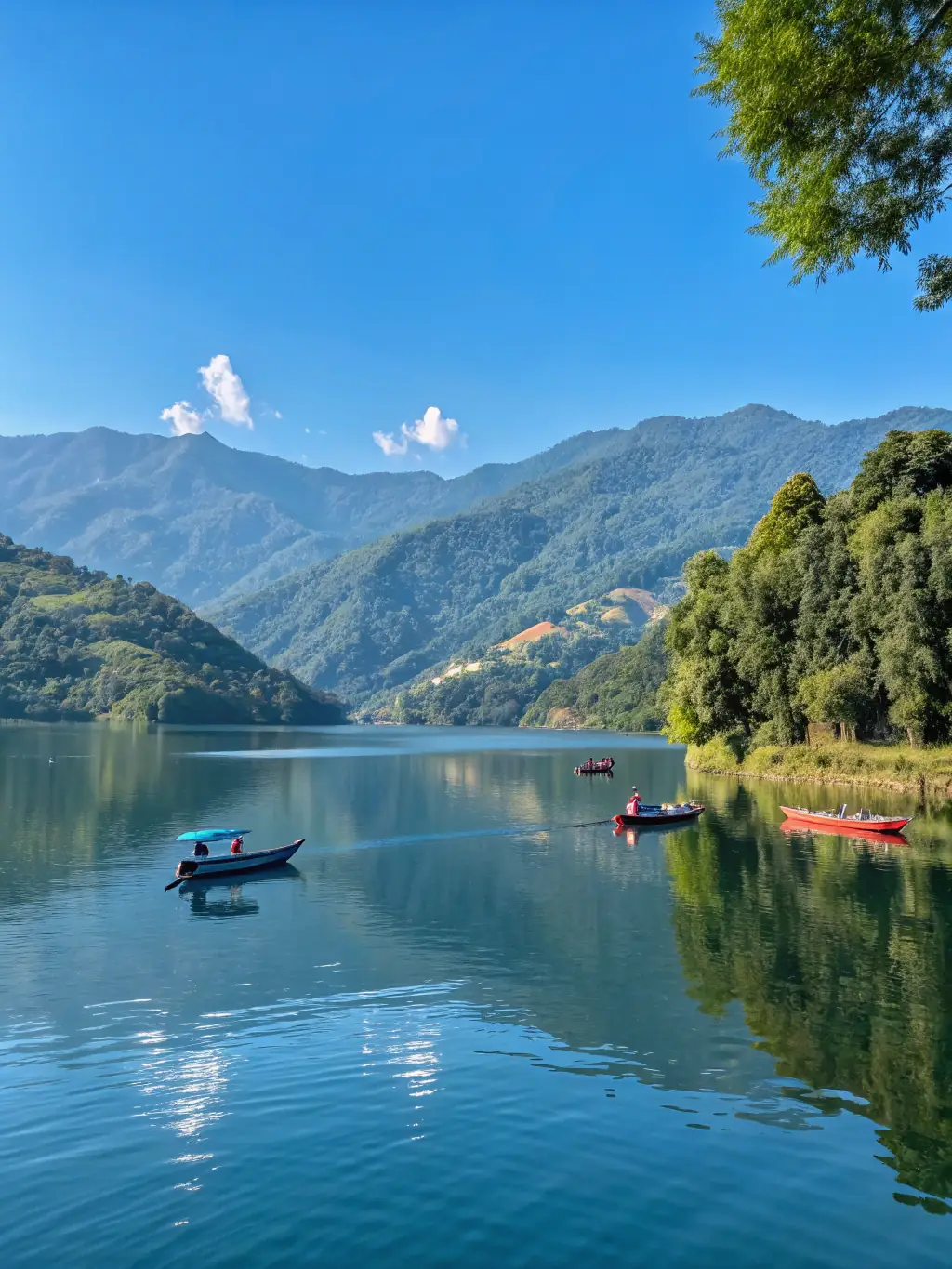 A scenic view of Pareloop lake with several sailboats gliding across the water, highlighting the beautiful and ideal location of CYVP.
